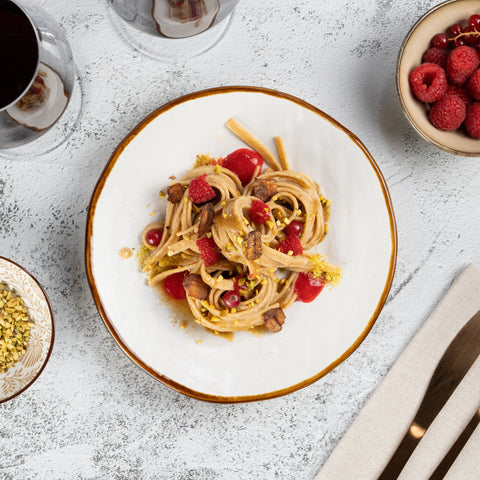 Umami Tagliatelle with Porcini Butter, Roasted Chestnuts, Raspberry and Currant Sauce, Pistachios